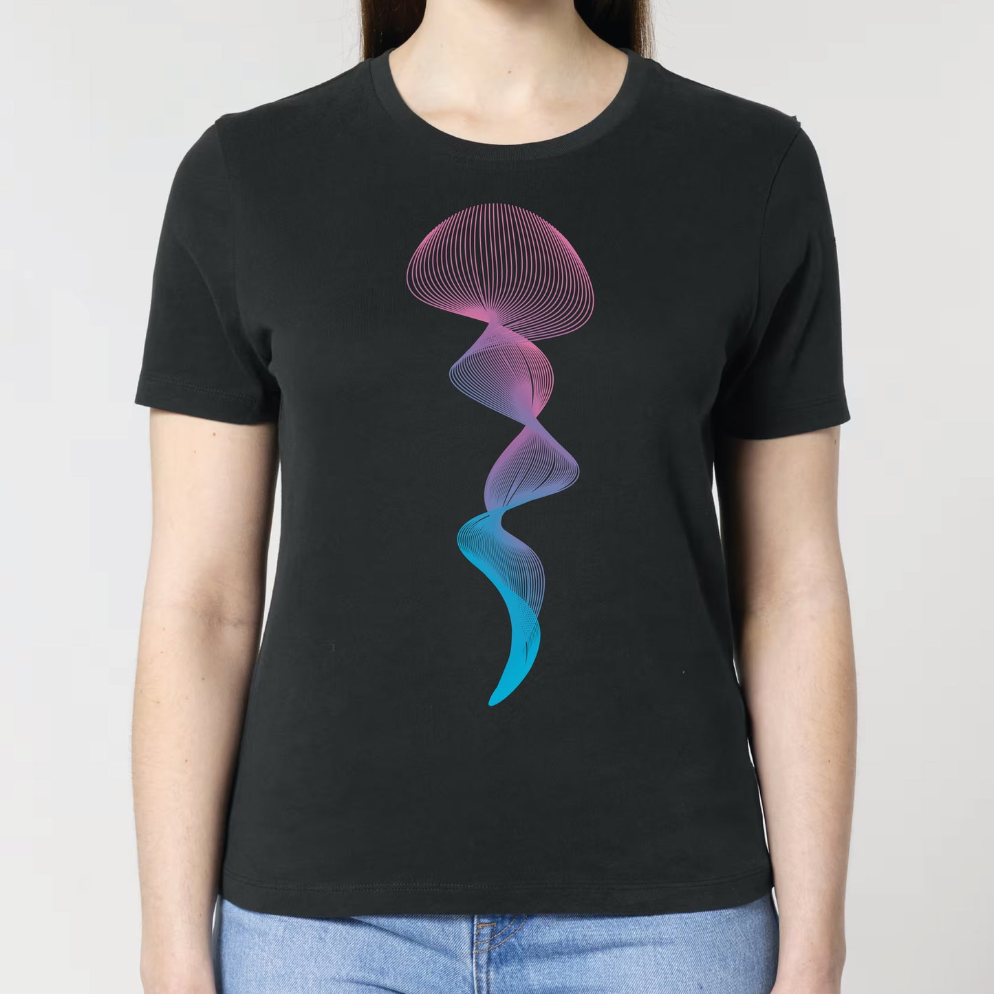 Person wearing a black t-shirt with a colorful jellyfish design on a plain background