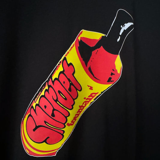 Black t-shirt with yellow and red graphic of a sherbet fountain sweet