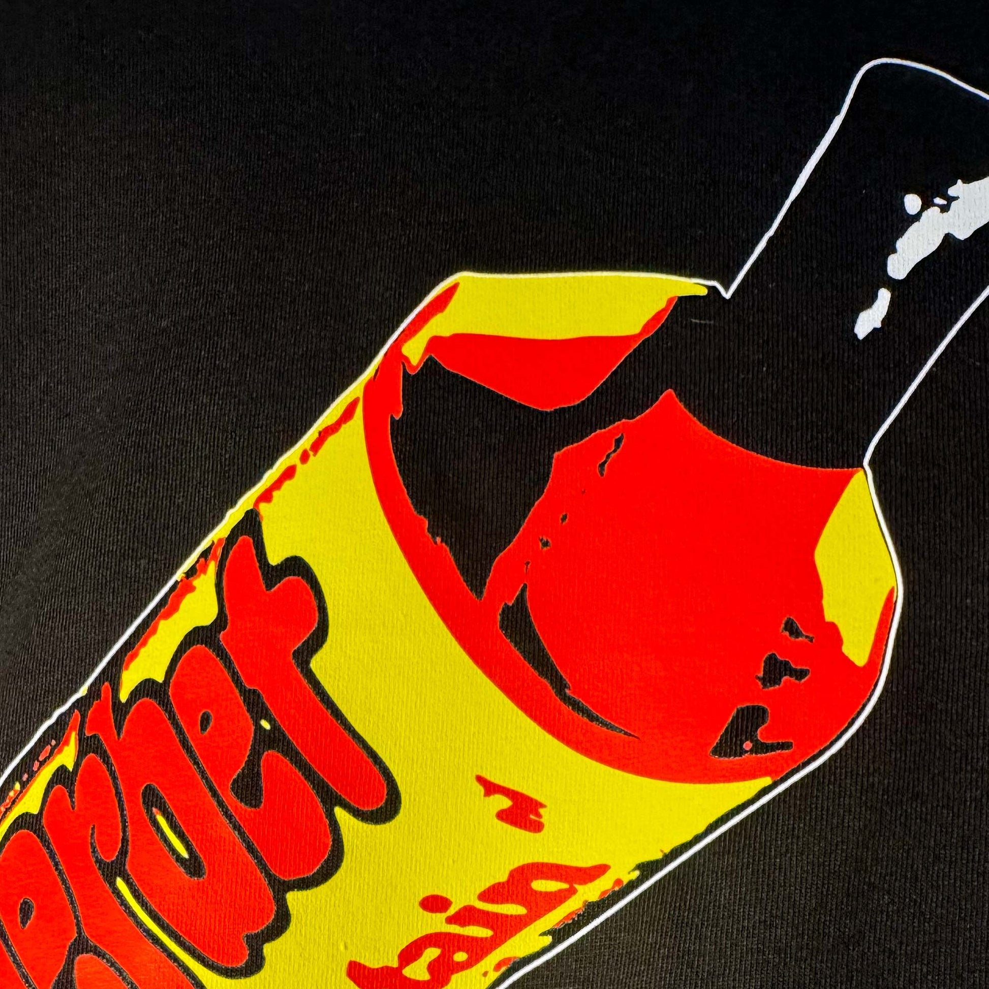 Black t-shirt with yellow and red graphic of a sherbet fountain sweet